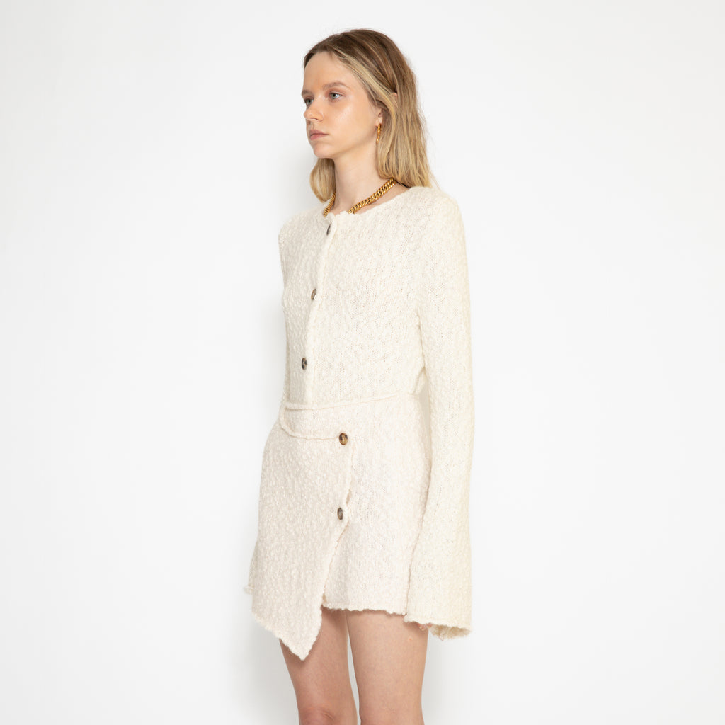 Thelma alpaca wool miniskirt from three-quarter side paired with Louise alpaca wool cardigan 