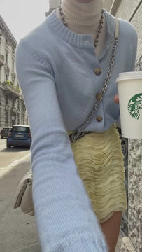 Video of the Giglio mini skirt styled with the Sonny light blue cashmere cardigan for a glam rock luxury outfit