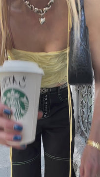 Video of the Trinacria ruffles top styled with jeans in Y2K style, perfect for cool clothing brands lovers and festival outfit ideas